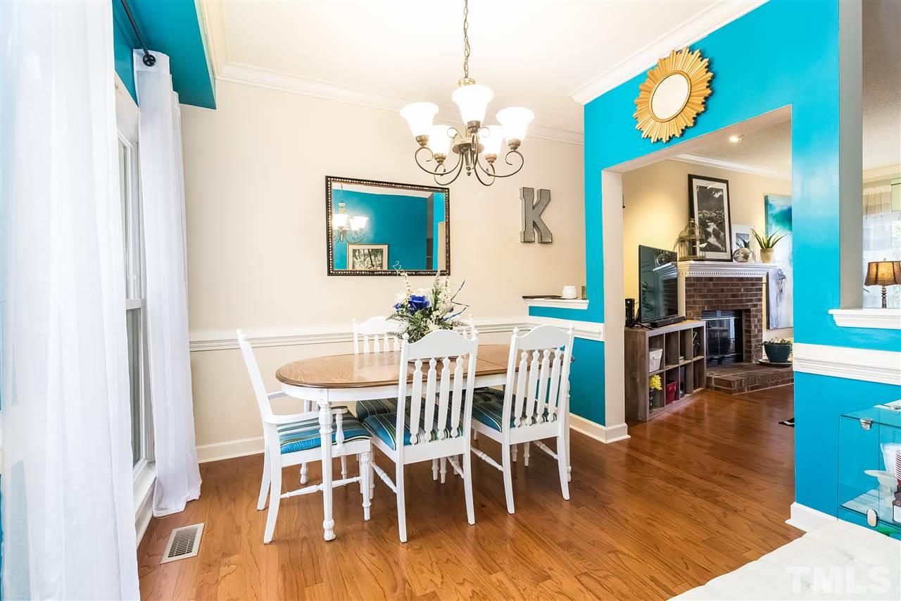 4201 Chelsford Place Raleigh, NC 27604 - Photo 6 of 24 a view of a dining room with furniture and wooden floor