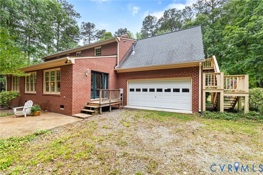 2615 Salisbury Road Midlothian, VA 23113 - Photo 31 of 36 a view of a house with a patio and a yard