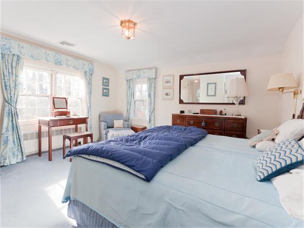 75 Lawson Road Winchester, MA 01890 - Photo 12 of 19 a bedroom with a bed and a large mirror