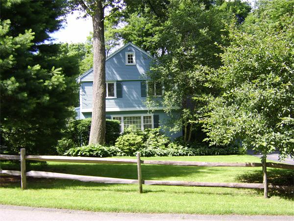 75 Lawson Road Winchester, MA 01890 - Photo 2 of 19 a front view of a house with a yard