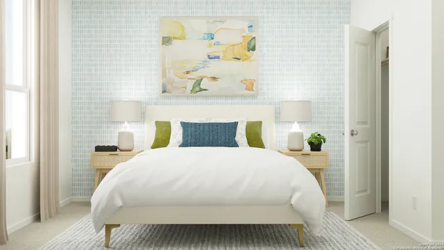 a bedroom with a bed and a wall painting