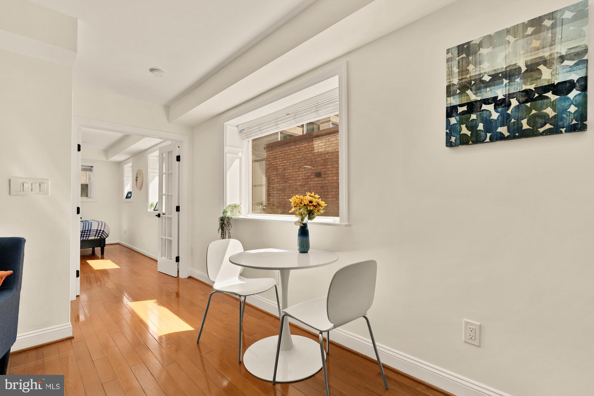 1125 12th Street Northwest, Unit 31 Washington, DC 20005 - Photo 11 of 25 a workspace with furniture and wooden floor
