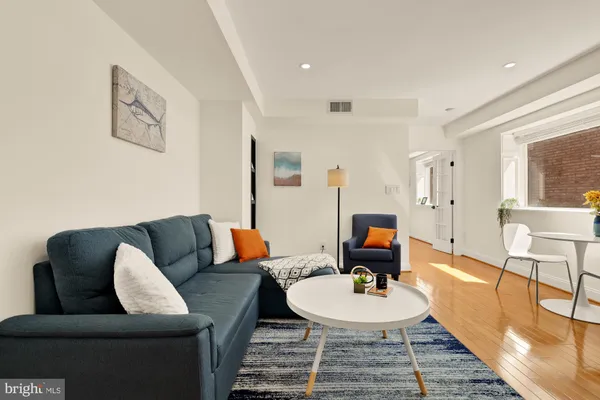 a living room with furniture and a table