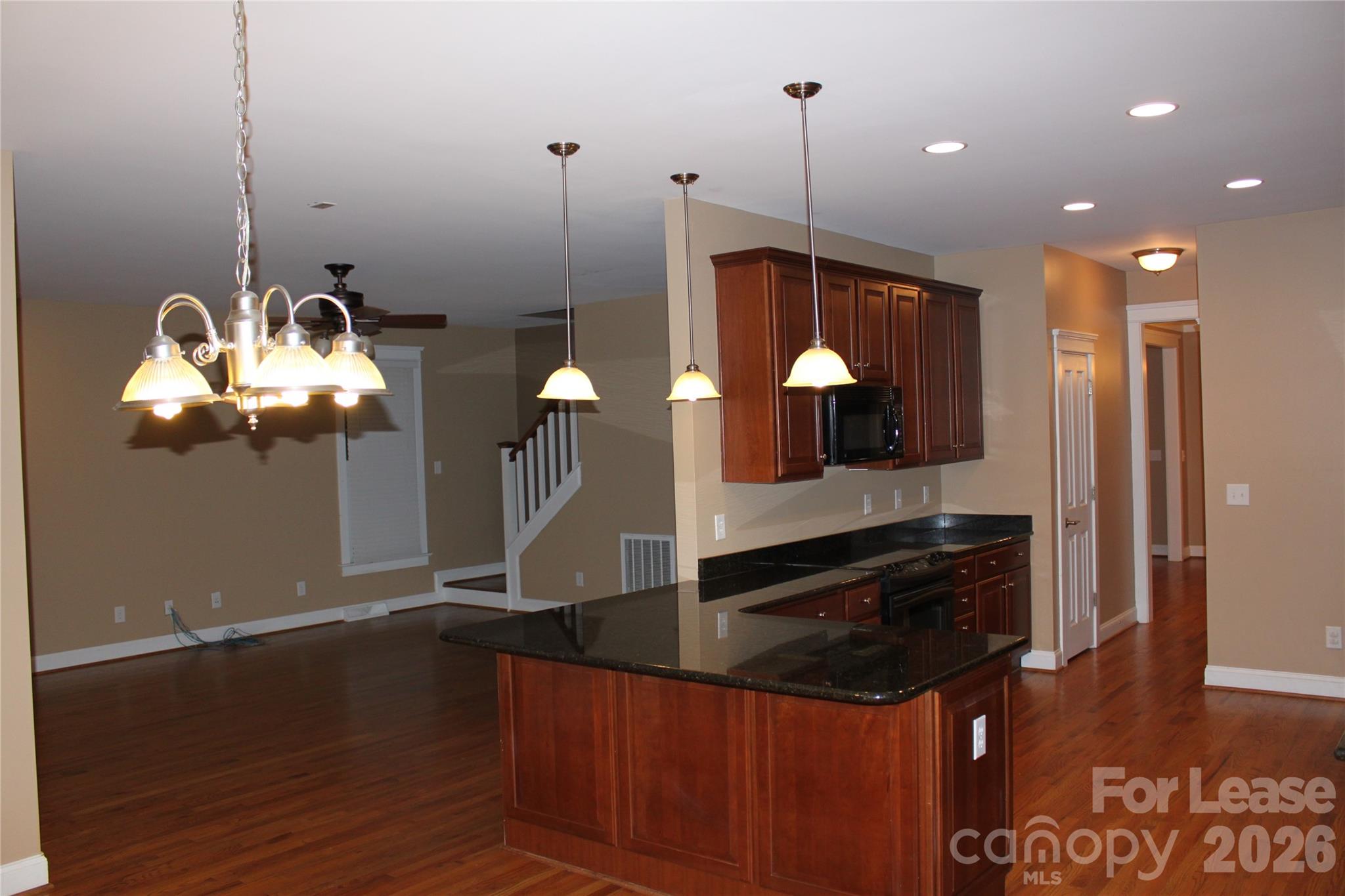 886 Promenade Walk Fort Mill, SC 29708 - Photo 9 of 14 a kitchen with a chandelier