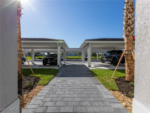 a view of a balcony with wooden floor and fence
