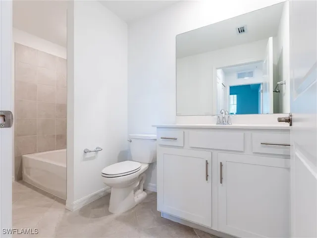 a bathroom with a sink toilet and vanity