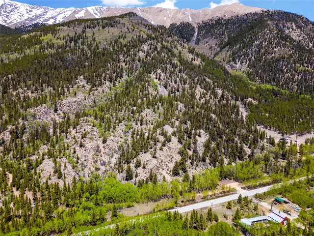 a view of a street with a big yard
