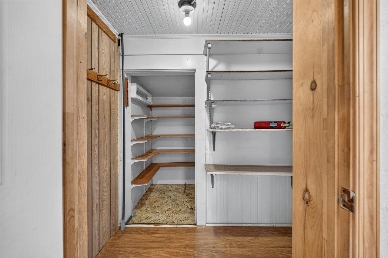 10402 Phillips Store Road Broadway, VA 22815 - Photo 17 of 68 a view of walk in closet with empty racks