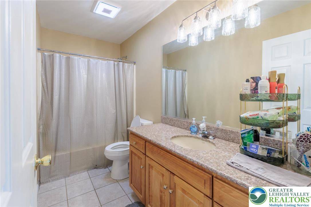 2170 Clearview Road Coplay, PA 18037 - Photo 46 of 75 This bathroom features a single vanity, a toilet, and a combination shower and tub.