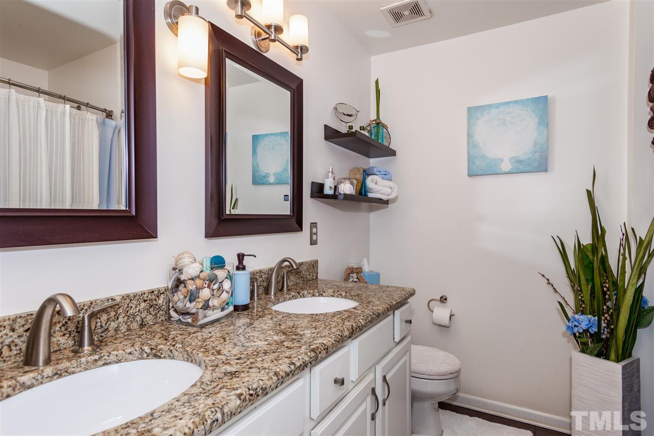 6014 Viking Drive Raleigh, NC 27612 - Photo 14 of 25 This master bathroom has been upgraded. Must see to appreciate. New counter top. New Tile. New picture frame mirrors. New lighting.