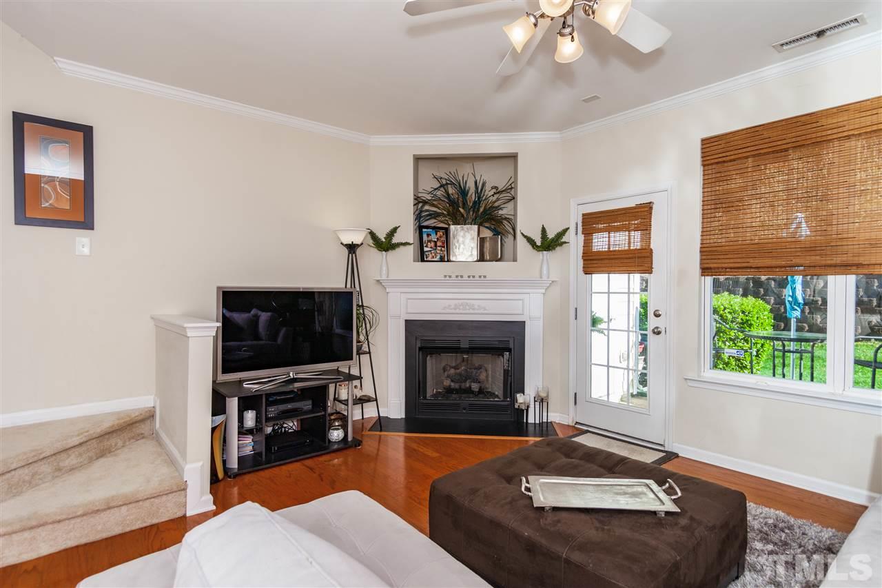 6014 Viking Drive Raleigh, NC 27612 - Photo 4 of 25 Gas fireplace for those holiday moments. Nice patio right off the family room.