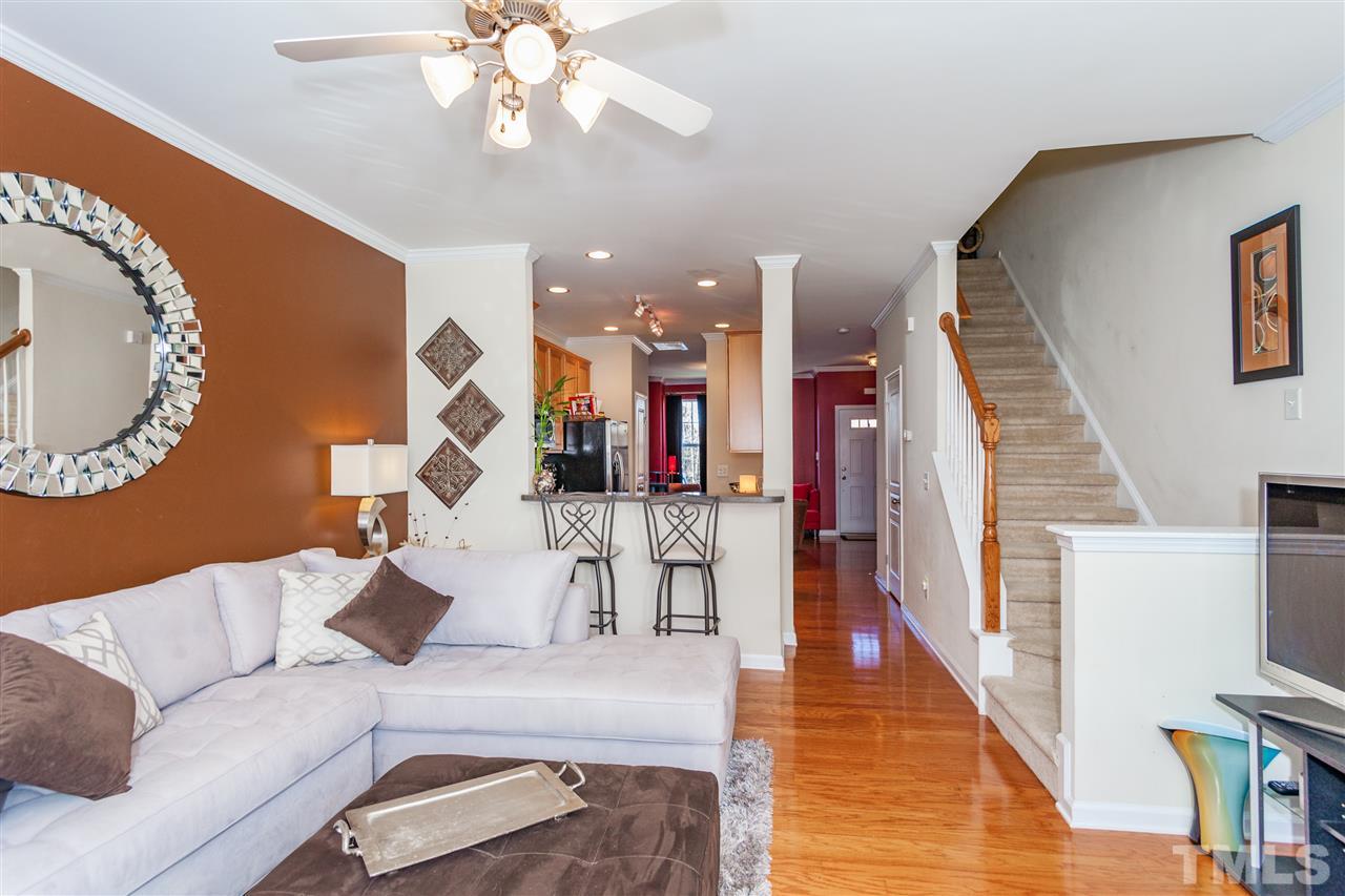 6014 Viking Drive Raleigh, NC 27612 - Photo 5 of 25 The family room is open to the kitchen. Check out the bar seating.