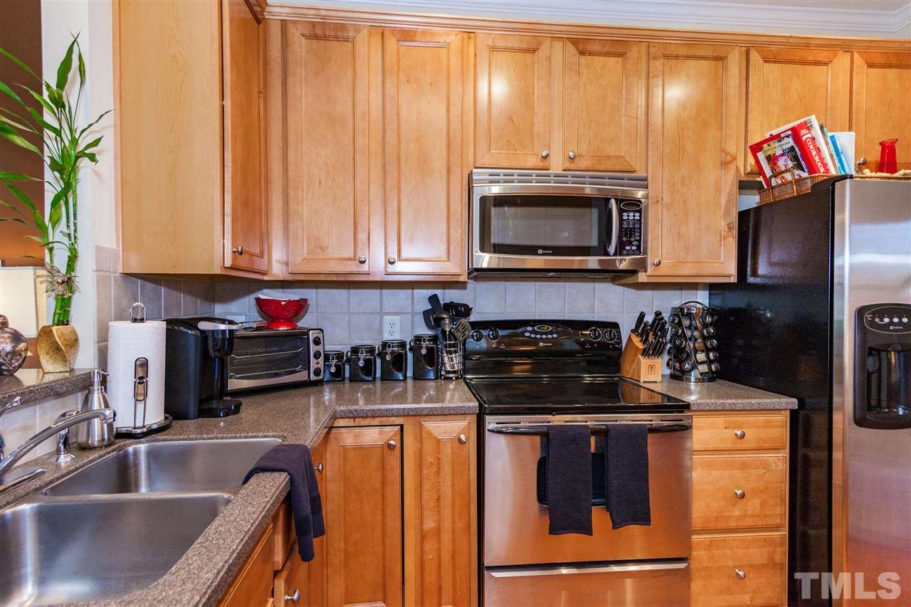 6014 Viking Drive Raleigh, NC 27612 - Photo 7 of 25 Stainless steel appliances are in great condition. Lots of prep space.