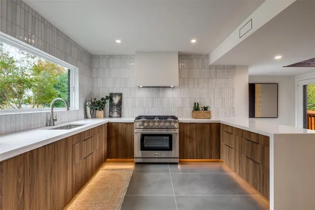 a kitchen with a stove and a sink