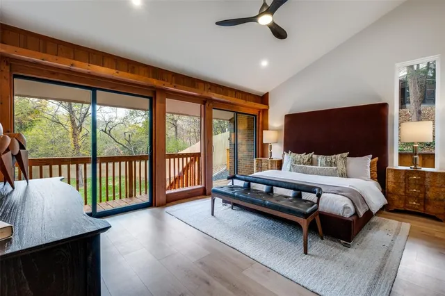 a bed room with a bed and flat screen tv