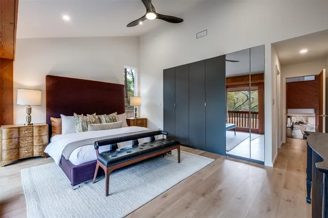 a bathroom with a double vanity sink toilet and shower