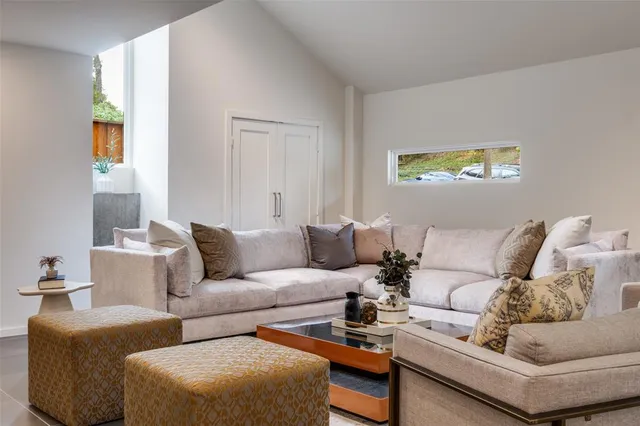 a living room with furniture and a couch