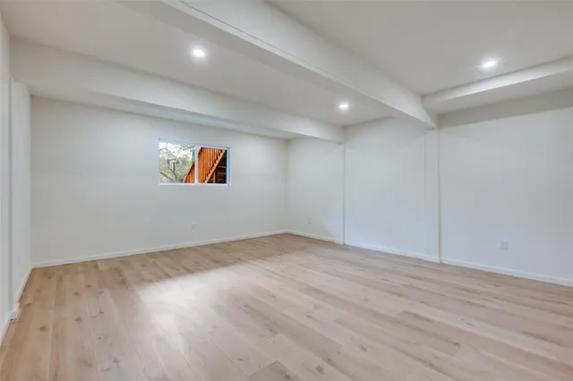 a view of a brick house with a large window