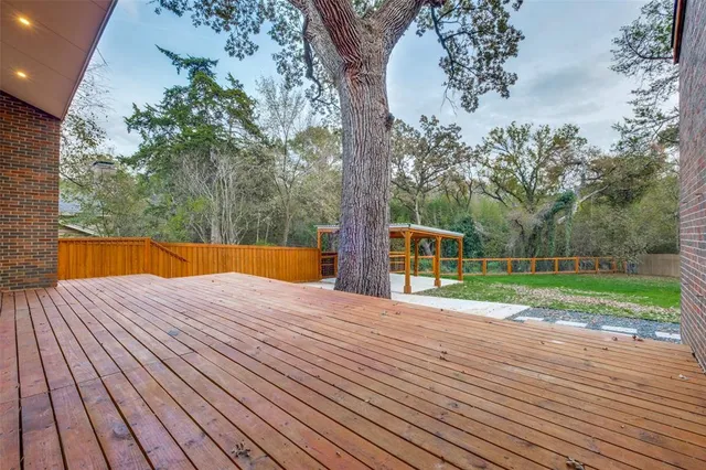 a view of a house with a backyard porch and sitting area