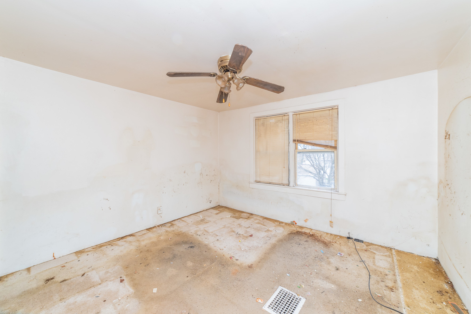 9154 South May Street Chicago, IL 60620 - Photo 19 of 40 a view of a room with a window and a ceiling fan