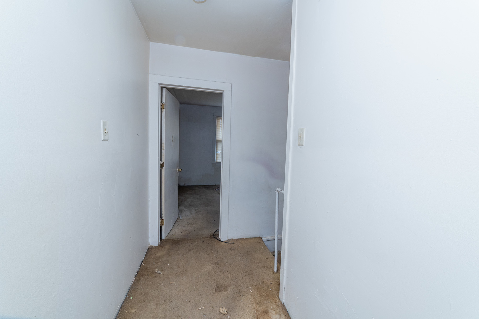 9154 South May Street Chicago, IL 60620 - Photo 22 of 40 a view of a hallway with a white walls