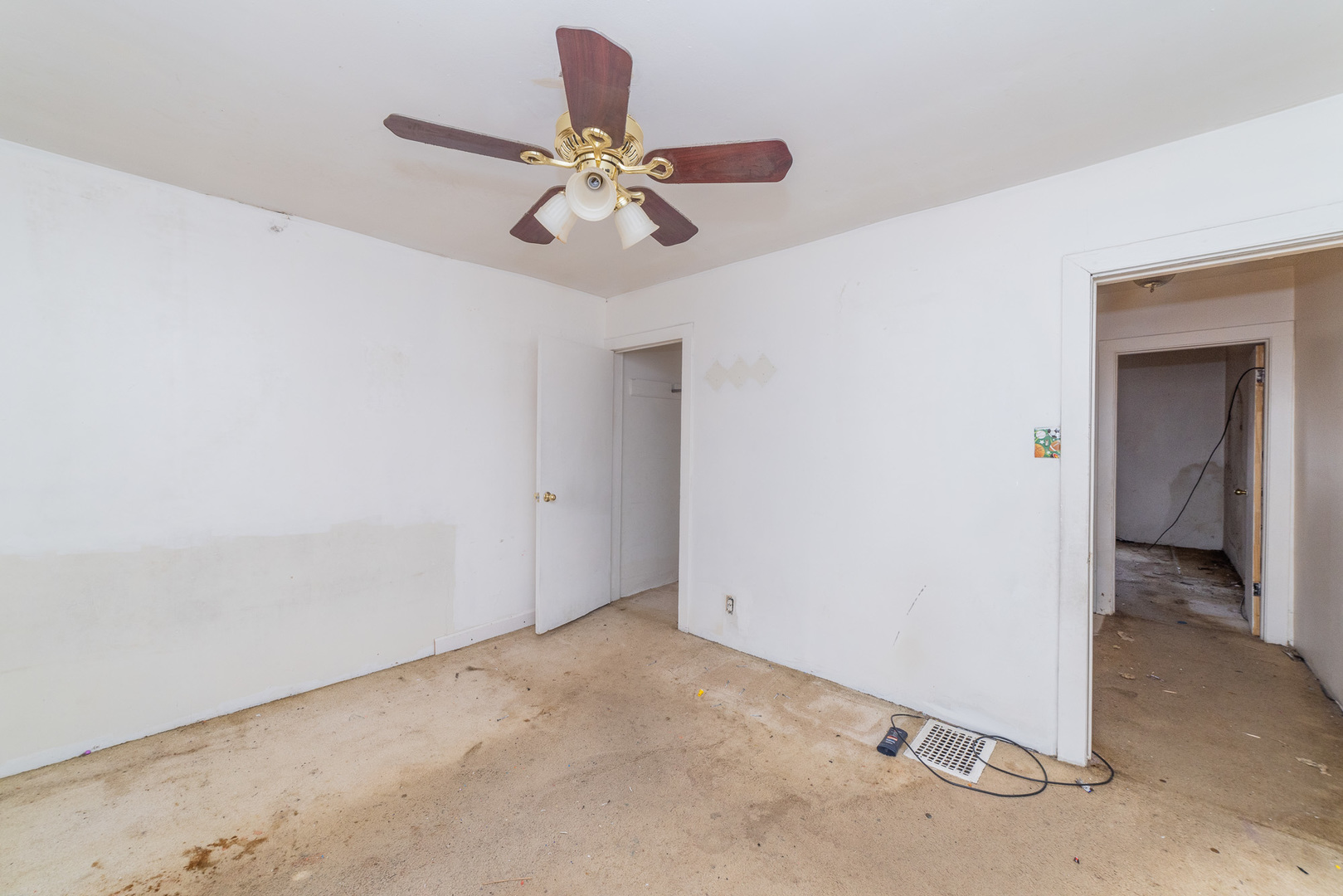 9154 South May Street Chicago, IL 60620 - Photo 24 of 40 a view of a room with a mirror and a fan