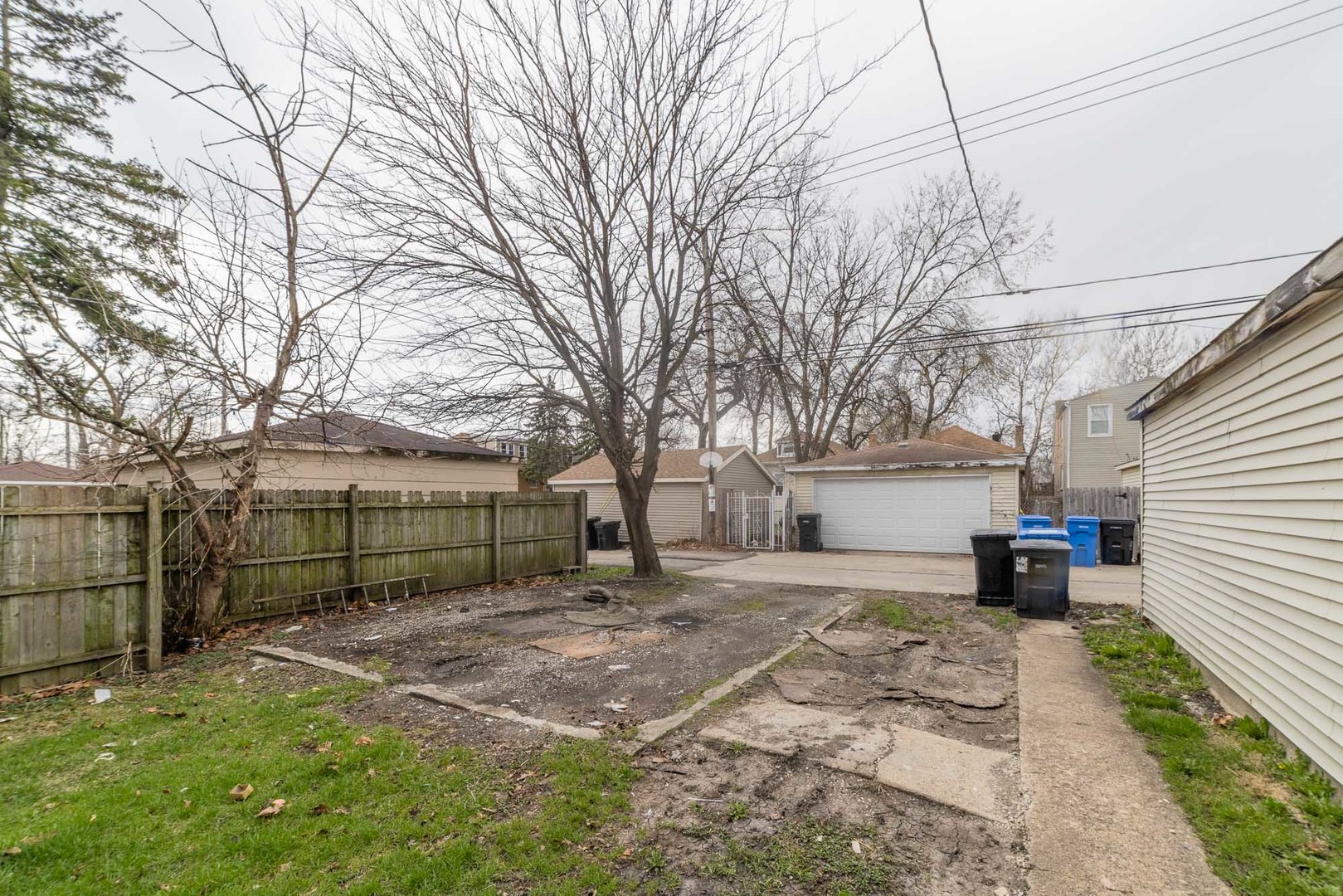 9154 South May Street Chicago, IL 60620 - Photo 36 of 40 a view of a backyard with a large tree