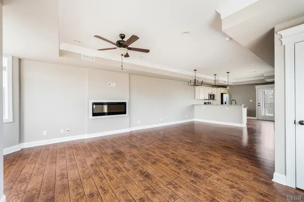 a bathroom with a granite countertop sink a toilet and bathtub