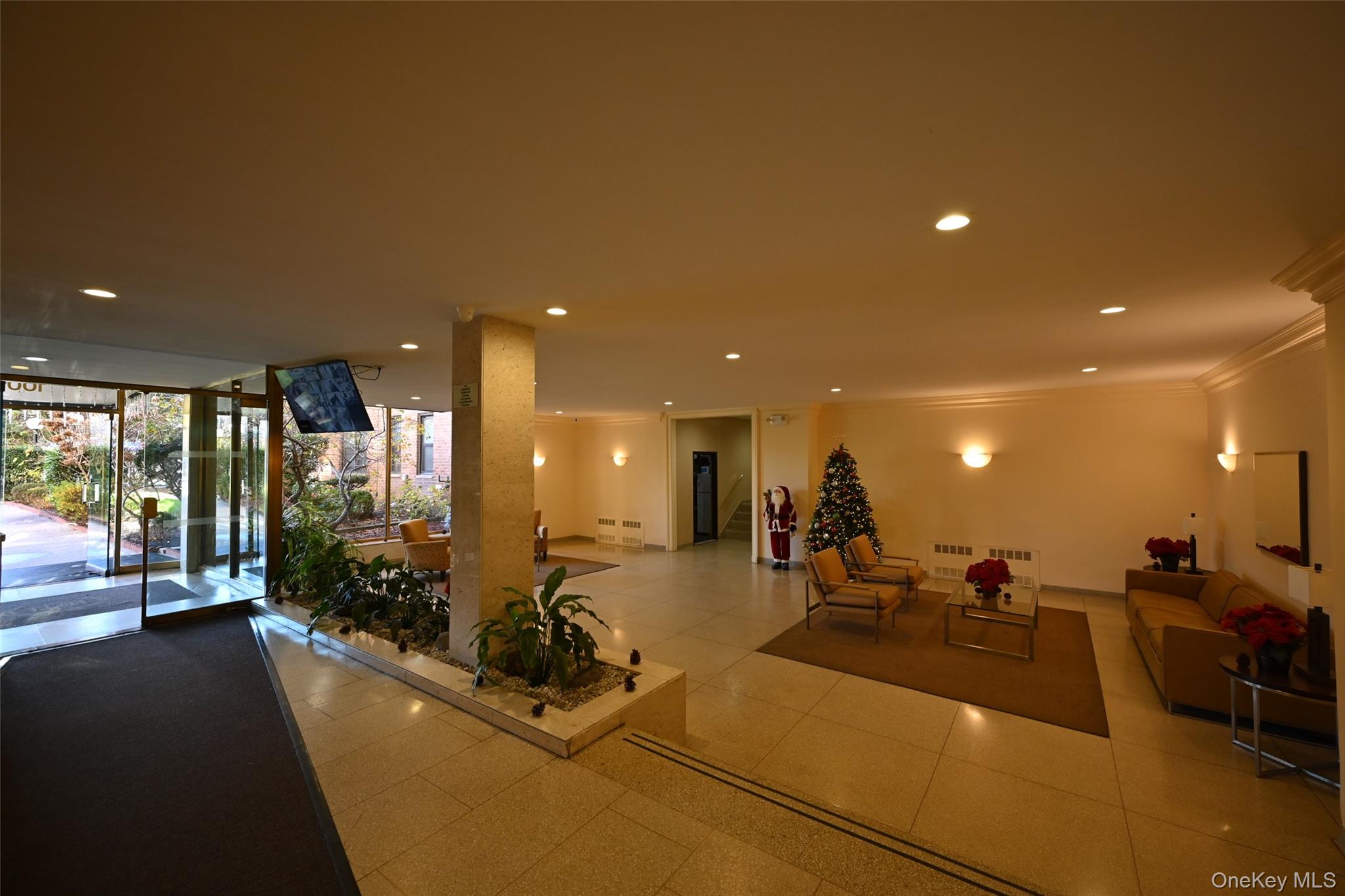 100-25 Queens Boulevard, Unit 7M Queens, NY 11375 - Photo 2 of 16 a large room with lots of gym equipment