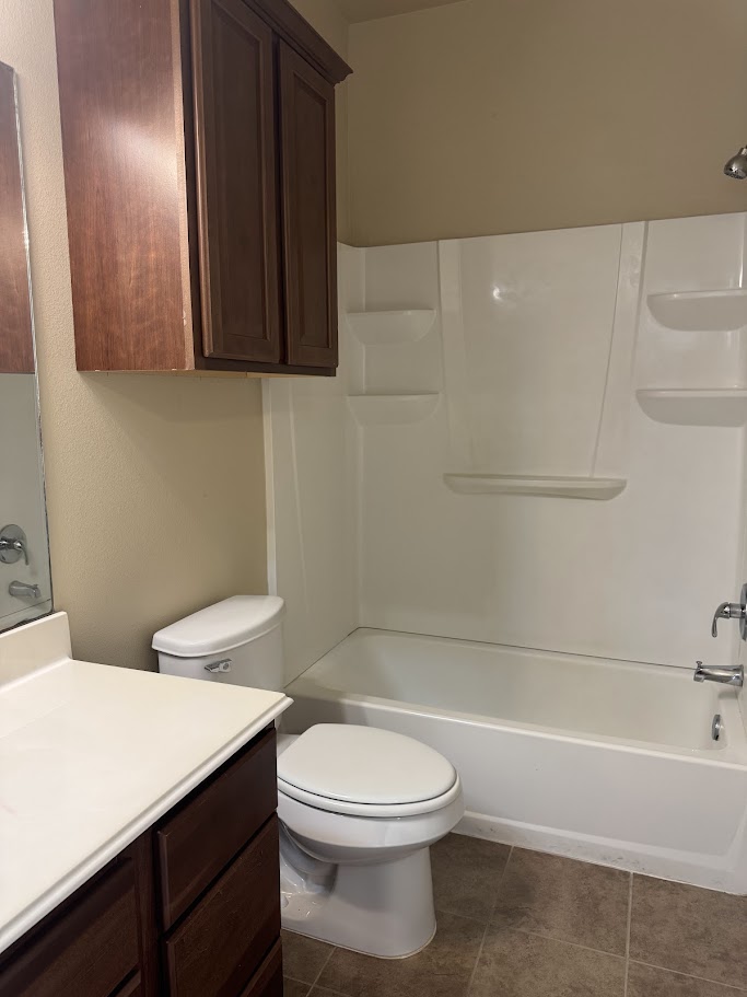 1198 Jones-Butler Road, Unit 1904 College Station, TX 77840 - Photo 8 of 17 Full bathroom featuring vanity, shower / tub combination, and dark tile patterned floors