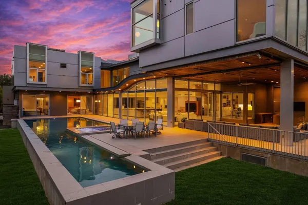 a view of swimming pool with a bench in balcony
