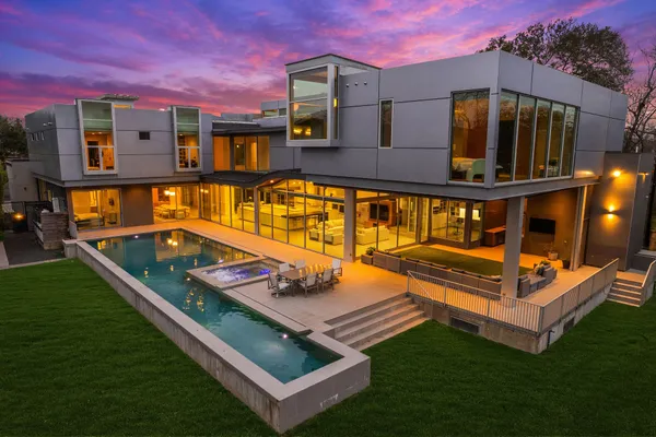 a view of a street with potted plants
