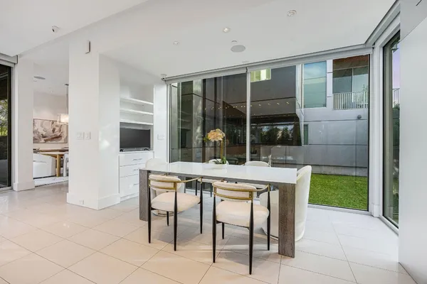 a bathroom with a shower sink and mirror