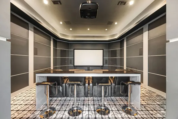 a dining room with furniture a chandelier and fireplace