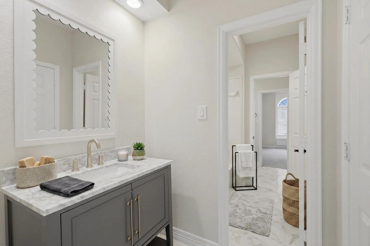 3315 Riviera Drive Sugar Land, TX 77479 - Photo 37 of 42 a bathroom with a sink and a mirror