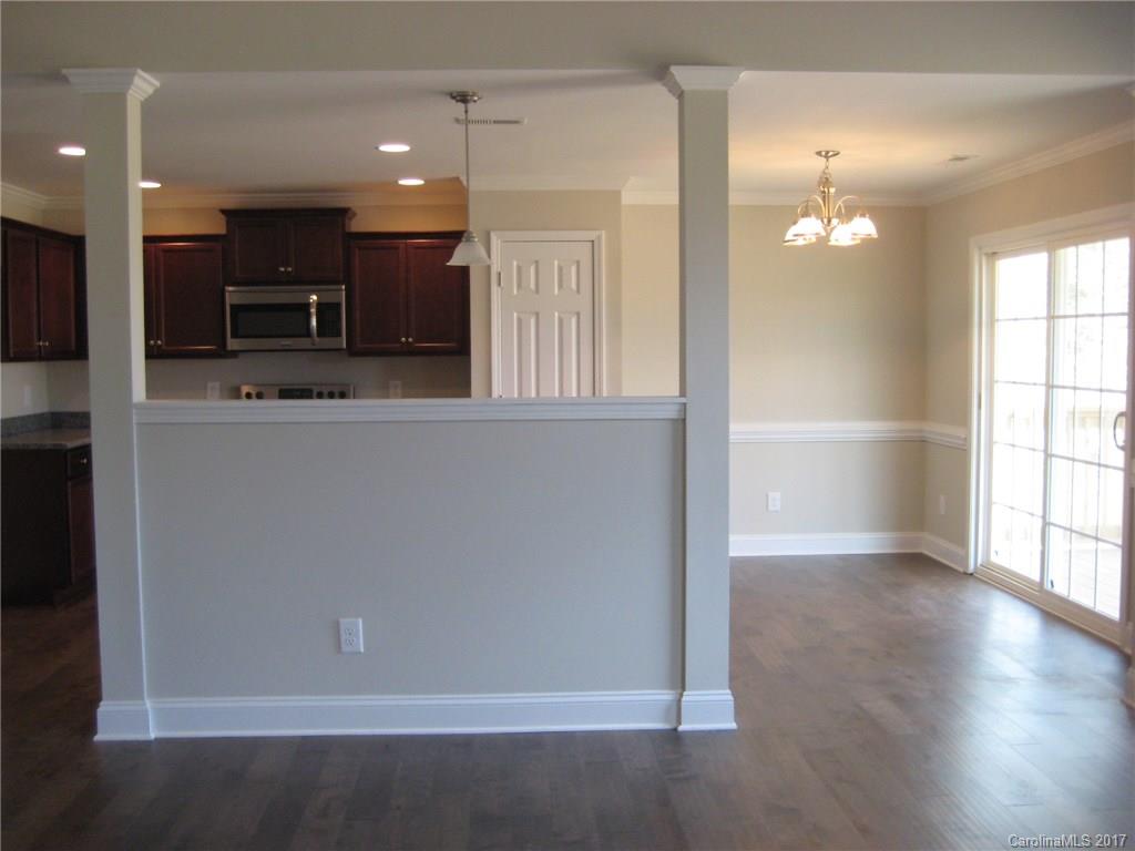 233 Springlake Road York, SC 29745 - Photo 5 of 21 an empty room with wooden floor and windows