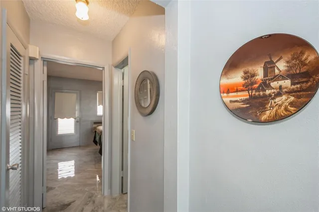 a bedroom with a bed and lamp