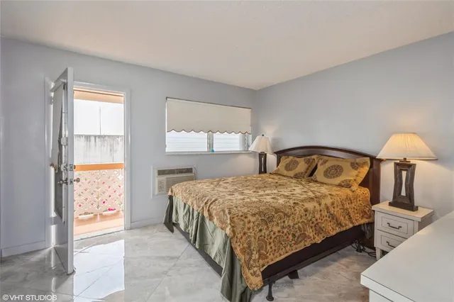 a bedroom with a bed and a cabinets