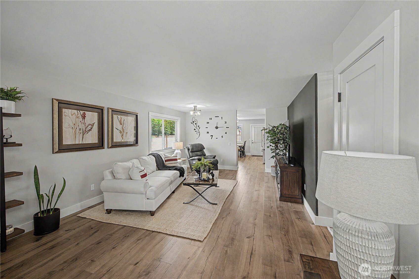 20919 Ronning Road Arlington, WA 98223 - Photo 7 of 28 a living room with furniture and a wooden floor