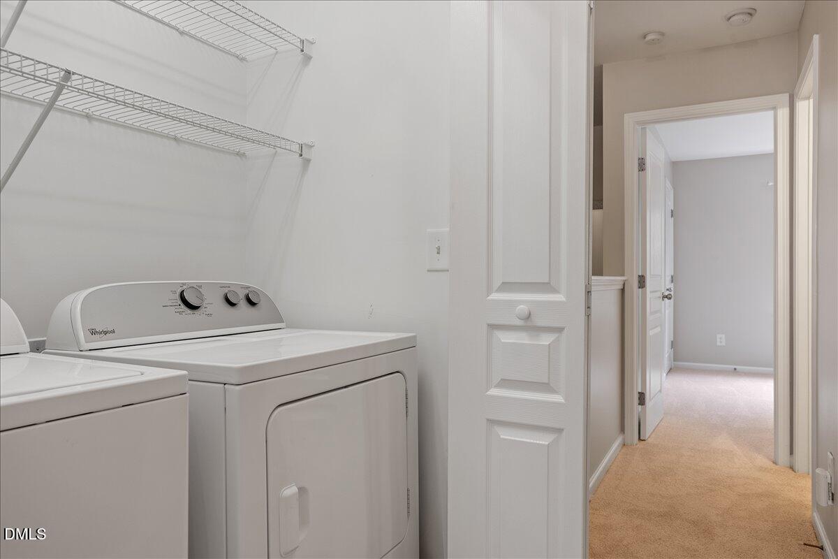 7734 Winners Edge Street Raleigh, NC 27617 - Photo 25 of 37 a utility room with dryer and washer