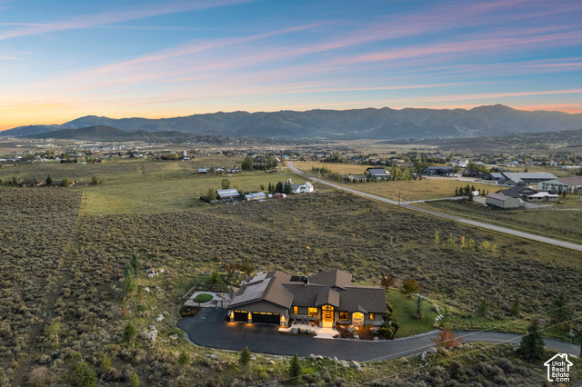 1130 Pace Road Park City, UT 84098 - Photo 70 of 73 Expansive lot featuring a contemporary residence with a dark-pitched roof, attached garage, and paved driveway