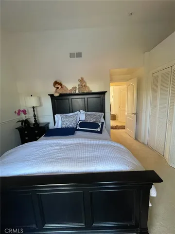 a bathroom with a double vanity sink mirror and toilet