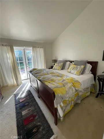 a backyard of a house with yard and a fountain