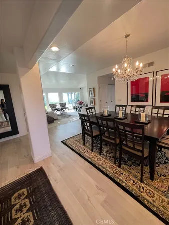 a dining room with furniture and chandelier or kitchen view
