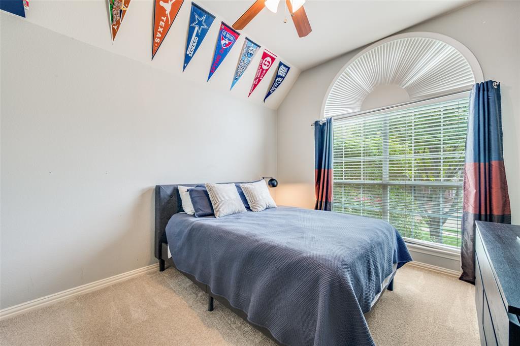 2109 Grayson Road McKinney, TX 75072 - Photo 18 of 31 Secondary bedroom, large window, lots of natural light.