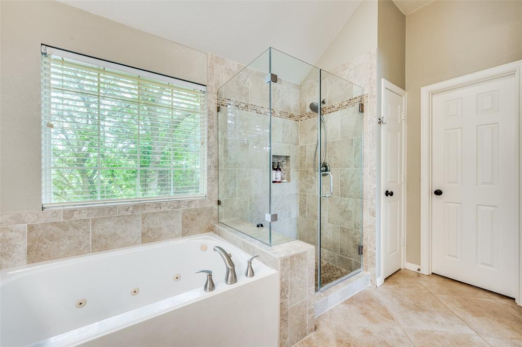 2109 Grayson Road McKinney, TX 75072 - Photo 25 of 31 Ensuite primary bath features jetted tub and separate frameless glass shower.