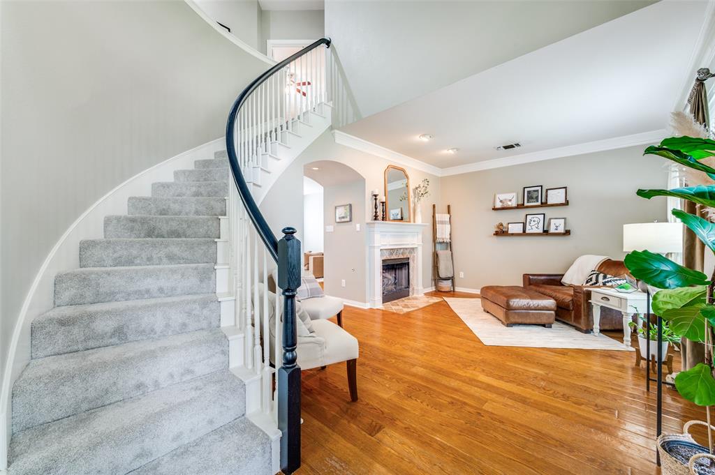 2109 Grayson Road McKinney, TX 75072 - Photo 3 of 31 Entry leads to beautiful winding staircase, formal dining on the left and cozy living are with gas log fireplace to the right.