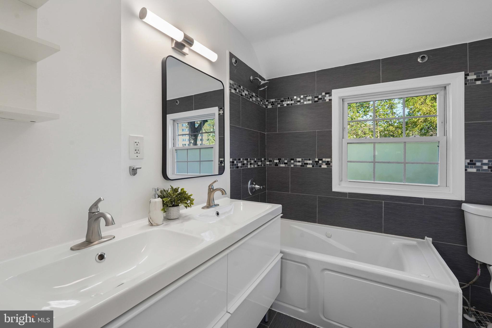 1910 Elkhart Street Silver Spring, MD 20910 - Photo 22 of 47 a bathroom with a sink and a bathtub