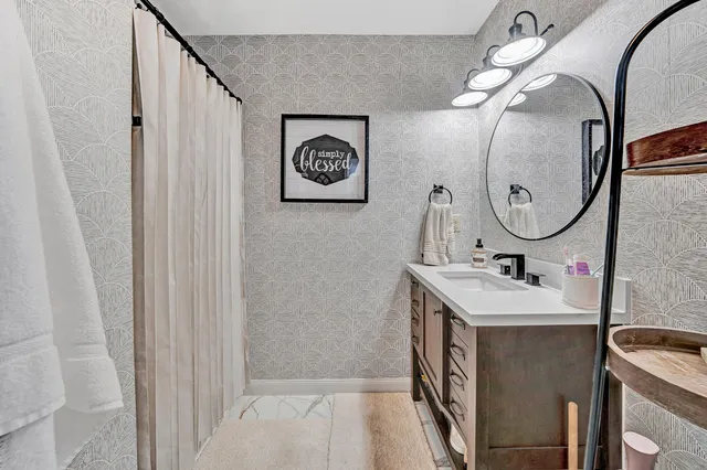 a bathroom with a sink and a mirror