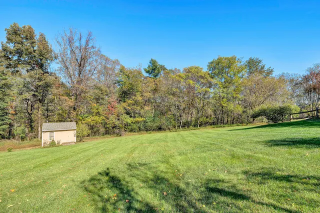 a view of a house with a big yard